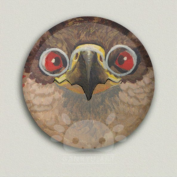 A mock up of a pin badge. It depicts a portrait painting of a gryphon. It's zoomed in to barley fit the face to emphasise its beak, making it very boop-able.